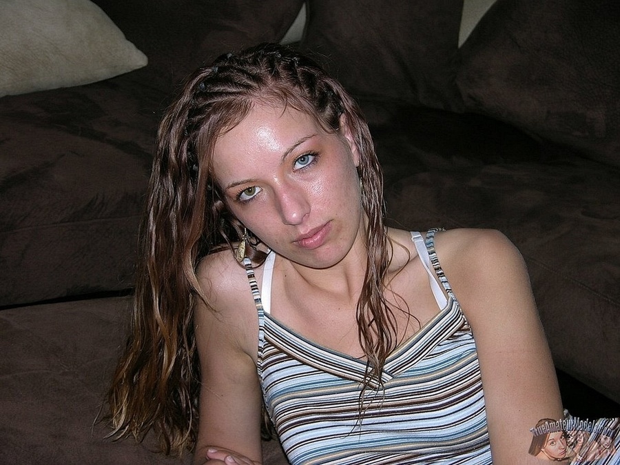 Teen chick sits on a brown couch then strips off her colorful striped shirt and jeans and teases with her foxy body in sexy underwear before she peels off her white bra and shows her petite boobs then strips down her black panty and bares her sweet pussy in different poses on a white bed. - XXXonXXX - Pic 3