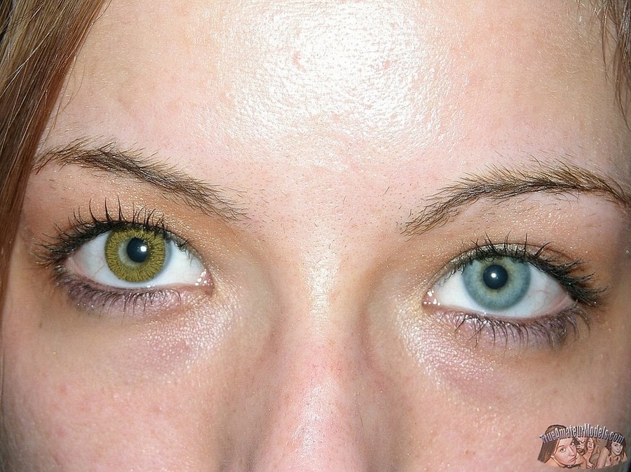 Teen chick sits on a brown couch then strips off her colorful striped shirt and jeans and teases with her foxy body in sexy underwear before she peels off her white bra and shows her petite boobs then strips down her black panty and bares her sweet pussy in different poses on a white bed. - XXXonXXX - Pic 13