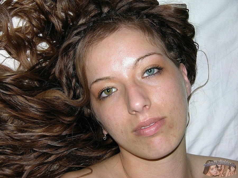 Teen chick sits on a brown couch then strips off her colorful striped shirt and jeans and teases with her foxy body in sexy underwear before she peels off her white bra and shows her petite boobs then strips down her black panty and bares her sweet pussy in different poses on a white bed. - XXXonXXX - Pic 15