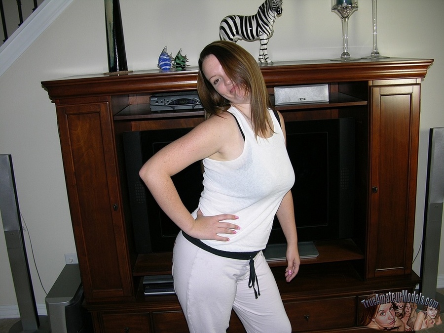 Hot chick takes off her white shirt and pants then displays her banging body in sexy underwear before she takes off her black bra and releases her big juggs then peels down her pink panty and expose her juicy pussy in different positions on a gray couch before she sucks a fat man's dick while she lets him lick her twat in sixty-nine position on a brown bed then bang her in doggy and missionary style. - XXXonXXX - Pic 3