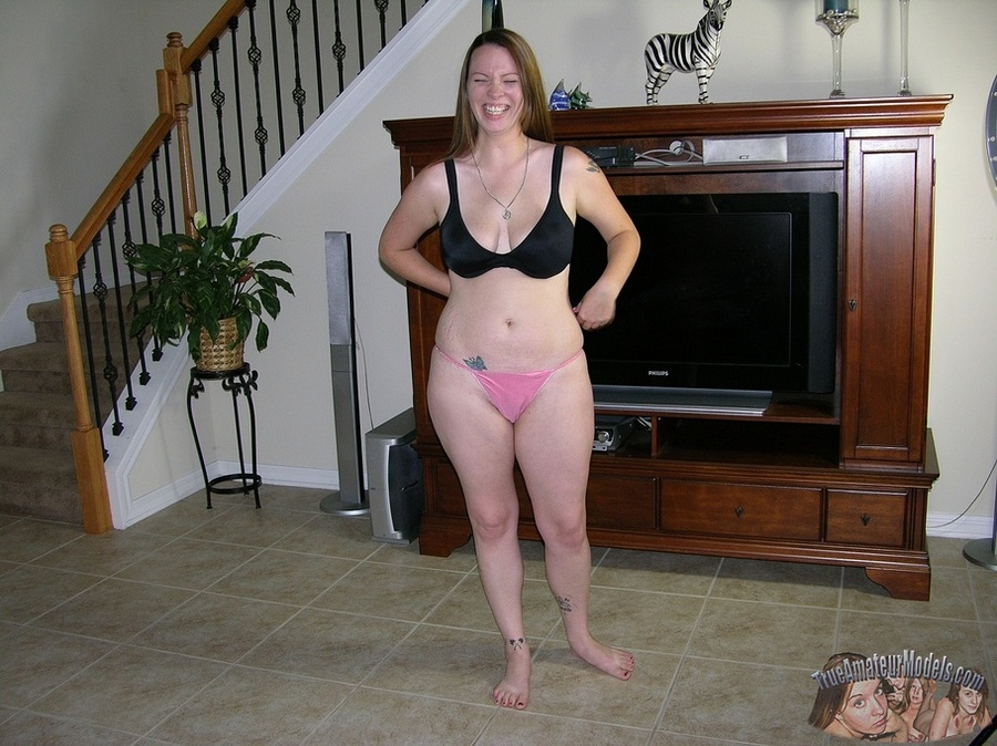 Hot chick takes off her white shirt and pants then displays her banging body in sexy underwear before she takes off her black bra and releases her big juggs then peels down her pink panty and expose her juicy pussy in different positions on a gray couch before she sucks a fat man's dick while she lets him lick her twat in sixty-nine position on a brown bed then bang her in doggy and missionary style. - XXXonXXX - Pic 4
