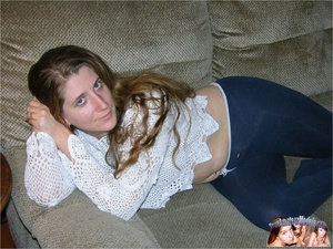 MILF hottie lays on a gray couch then removes her white blouse and jeans and expose her soggy big tits and nasty pussy before she sucks a bald man's cock then lets him lick her hairy twat before he fucks her in missionary and doggy positions on a gray bed. - Picture 2