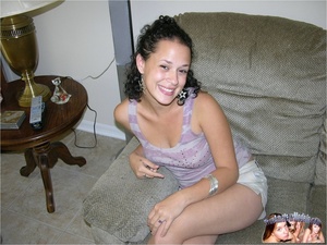 Beautiful Hispanic teen pose her foxy body on a gray couch before she takes off her purple and gray shirt and reveals her indulging boobs then drops down her white shorts and teases with her lusty pussy in different poses on a gray sofa and bed. - Picture 2