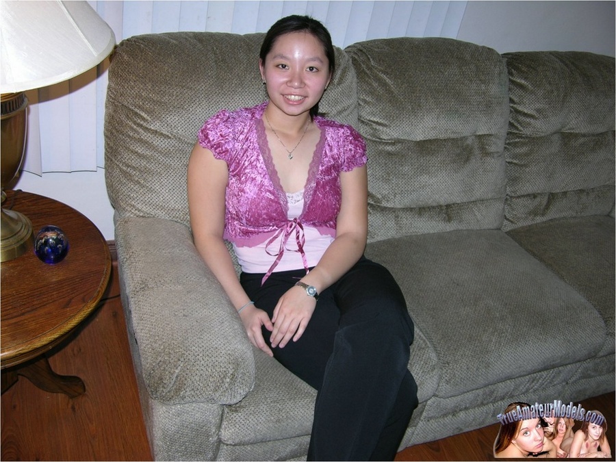 Asian hottie peels down her black slacks then teases with her luscious butt as she lays prone on a gray couch before she strips off her purple blouse and black shoes and expose her indulging crack in different poses on different beds and couches. - XXXonXXX - Pic 2