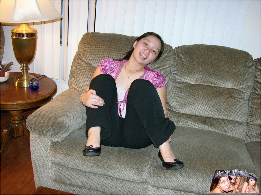 Asian hottie peels down her black slacks then teases with her luscious butt as she lays prone on a gray couch before she strips off her purple blouse and black shoes and expose her indulging crack in different poses on different beds and couches. - XXXonXXX - Pic 3