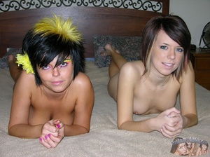 Teen chicks strips off their pink and yellow shirts then displays their foxy bodies before they peel off their pink and white bras and reveals their hot boobs before they pull down their colorful skirts and pink and white thongs then expose her luscious pussies in different positions on a white couch. - XXXonXXX - Pic 11