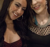 Trannie in black stockings has a tart on her back in an empty bar room,
