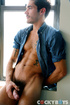 Gorgeous dude expose his muscular body as he opens his blue shirt before