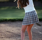 Teenage chick playing golf and showing her natural titties