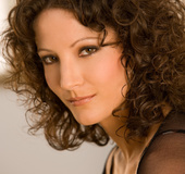 Curly haired woman in black will blow your mind for sure