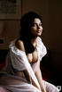 Dark haired vintage Playmate showing her perky boobies