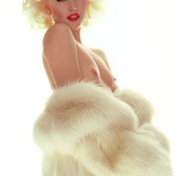 Super sexy blonde darling posing in a nice fur coat