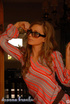Elegant blonde woman with glasses shows her sexy curves