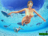 Brunette nymph with huge boobs fucking in the ocean with water sprite