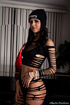 Lusty chick with smoking hot body in sexy black outfit with bonnet expose