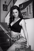Gorgeous chick with hot black hanging blouse and black and white skirt