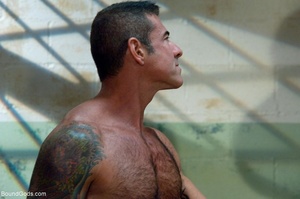 Tattooed bear jeering black lad and his  - Picture 10