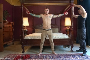 Tattooed hunk gets tied up and sucked of - Picture 1