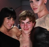 Short-haired tranny in a latex ensemble wows a woman and a man in an extremely