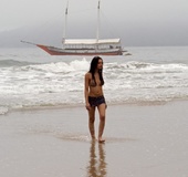 Hot couple fucking on the beach consists of a tranny and her open-minded