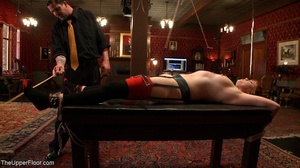 When tied to a table, a miss with red ha - Picture 10