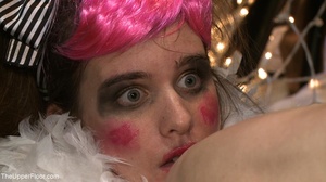 Pale girl’s face is painted like a clown - Picture 11