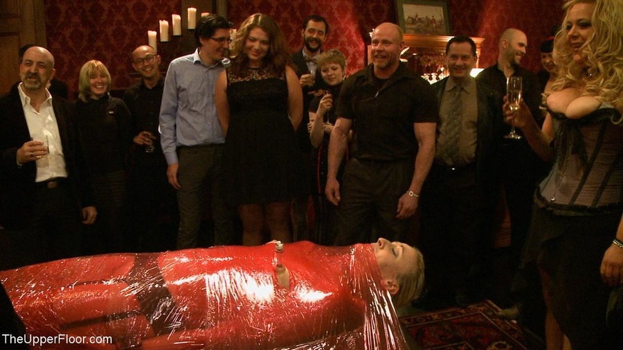 Blonde is secured to a table with red plast - XXX Dessert - Picture 1