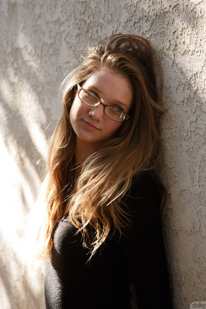 Long haired teen gal with glasses shows  - Picture 1
