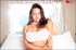 In steamy bedroom strip session, hottie wears white lace panties and reveals