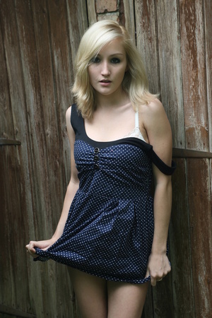 Blonde cutie in polka-dots slowly shows off her body in the backyard - Picture 4