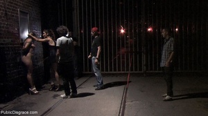 Slut is cuffed to a subway gate late at  - Picture 12