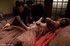 Girl is held high in the air as she is tied with thick rope, then placed