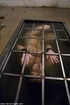 Caged cutie with dark hair licks dirty boots and sucks hard dick without