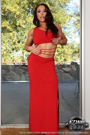 Busty brunette gal in a red dress showin - Picture 2