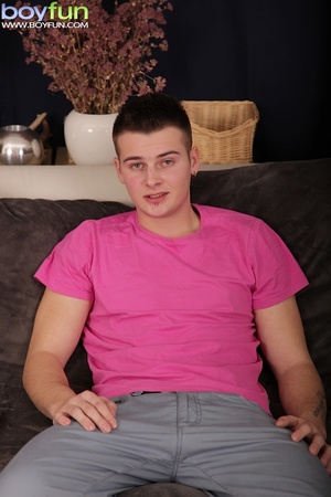 Skinny boy wearing pink shirt masturbates on the sofa and cums hard - Picture 1