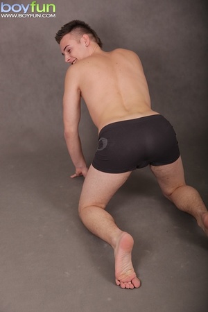 Pretty gay wears nice black briefs and poses in hot positions on the floor - Picture 7