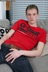 Pretty lad with long legs enjoys some action in his couch