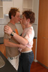 Young gay couple make out on the kitchen table and fuck
