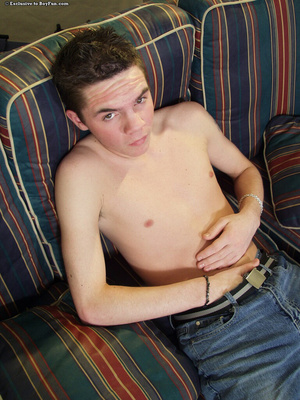 Young gay teen strips down naked on the couch and gets naughty - Picture 5