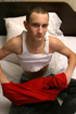 Dude with short hair and long dick masturbates on bed
