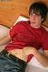 Black-haired model jerks off his cock on the couch in his free time