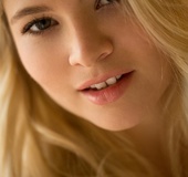 Mesmerizing blonde with dimple on cheeks flaunts tanned tits and cute