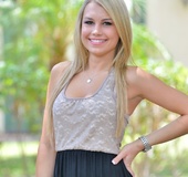 Smiling blonde model showing her pussy in a close up