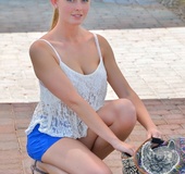Slender blonde angel fingering her tight anus in public