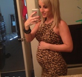 Pregnant blonde pornstar showing off her beautiful belly