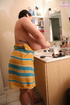 busty brunette bears all