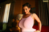 This girl's skimpy pink tank top can barely hold her gigantic boobs