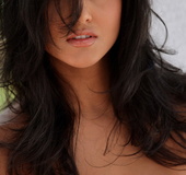 Gorgeous small-breasted black-haired babe in orange-lace panties bends