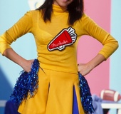 Pretty cheer-leader strips-off skirt, white-cotton bra and panties and