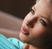 Sensual brunette with playfull-smile shows-off shapely ass in blue panties